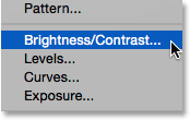 Selecting a Brightness/Contrast adjustment layer. Image © 2015 Steve Patterson, Photoshop Essentials.com