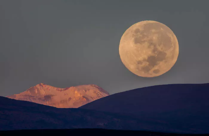 An image of the moon above a landscape - landscape photography 