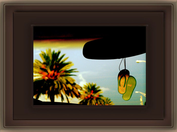 A photo looking out the front window of a car, with a PNG Photoshop frame 
