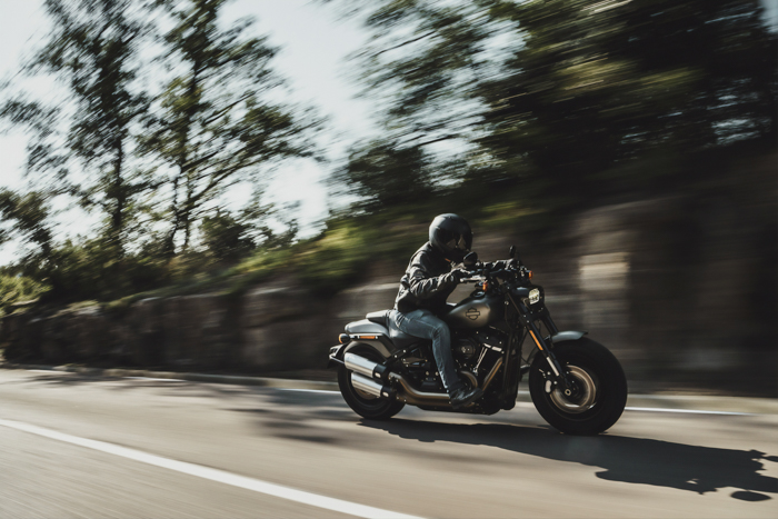An image of a motorcyclist driving with blurred background