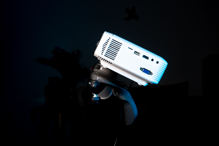 A digital projector on black background