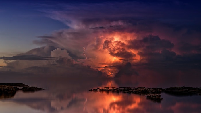 photo of colorful clouds above a waterscape