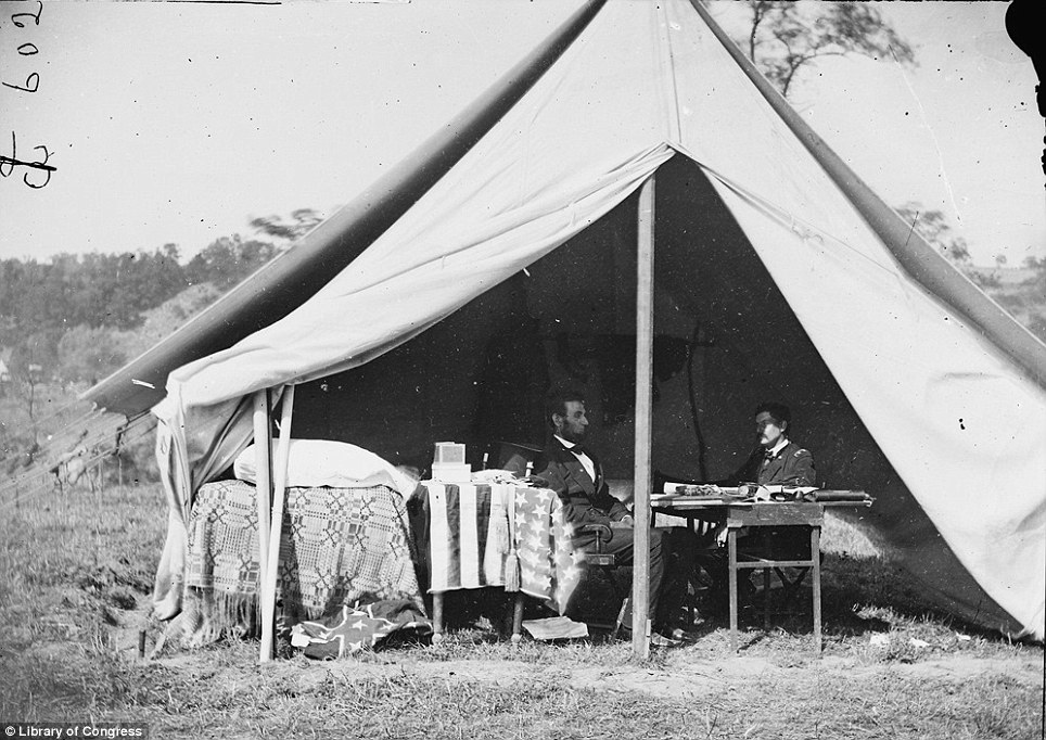Abraham Lincoln, left, sits in his tent with one of his generals during the Civil War