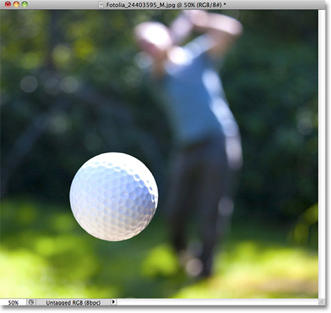 A close up photo of a golf ball. Image licensed from Fotolia by Photoshop Essentials.com