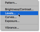 Choosing a Levels adjustment layer in Photoshop. 