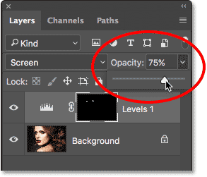Lowering the opacity of the Levels adjustment layer. 