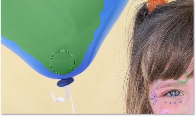 Continuing to paint over the balloon with the Color Replacement Tool. Image © 2016 Photoshop Essentials.com