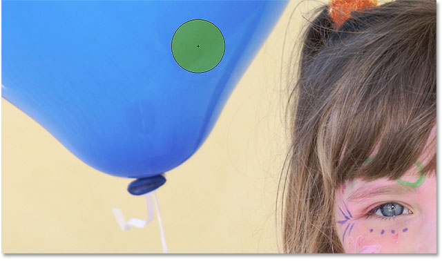 Clicking on the blue balloon with the Color Replacement Tool. Image © 2016 Photoshop Essentials.com