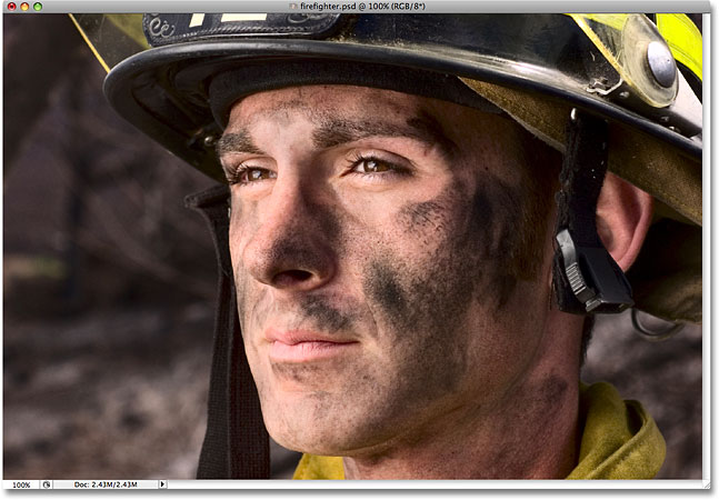 A photo of a firefighter. Image licensed from iStockphoto by Photoshop Essentials.com.