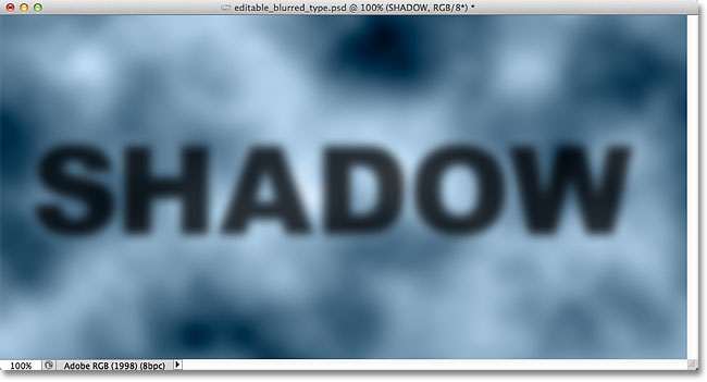 The blurred shadow text is now fully visible. Image © 2012 Photoshop Essentials.com.