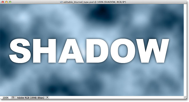 The drop shadow appears around the edges of the letters in the document window. Image © 2012 Photoshop Essentials.com.