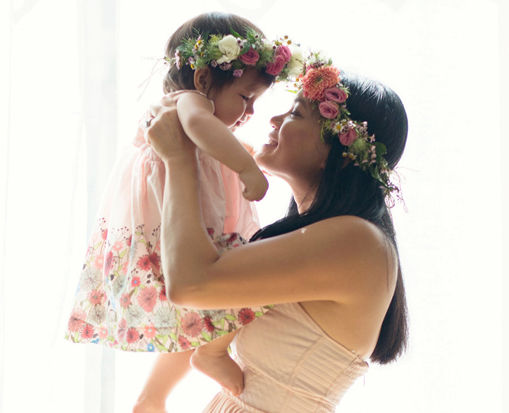 baby and mom with flower crowns